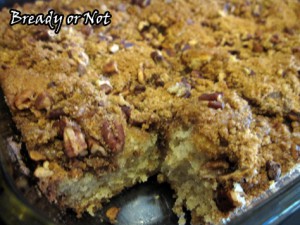 Make the streusel topping first by combining the brown sugar, pecans and cinnamon in a small bowl. Set aside. In a big bowl, beat the butter and white sugar until light and fluffy; add the eggs, one at a time, beating well after each. In a separate bowl, whisk together the dry ingredients: flour, baking powder, baking soda, nutmeg and salt. Slowly add the flour mix to the eggs and butter. Pause to add in some sour cream, then more flour, going back and forth until it's all blended. Apply nonstick spray to a 9x13-inch pan. Pour in the batter and spread to the edges. Sprinkle the streusel all over the top. Cover well with plastic wrap and chill overnight, or up to 18 hours. Preheat the oven at 350-degrees. Remove the plastic wrap. Bake the cake for 35 minutes, or until a toothpick comes out clean. Serve warm or at room temperature. !HO HO HO & OM NOM NOM!